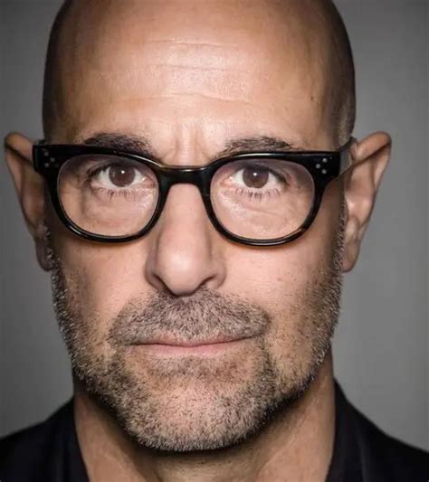 famous bald men with glasses.